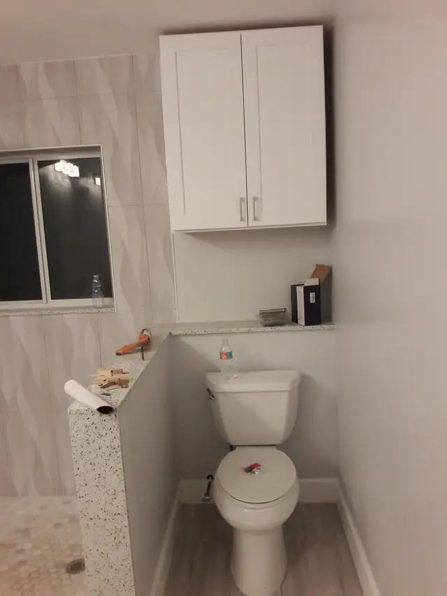 Bathroom storage cabinet installed above toilet