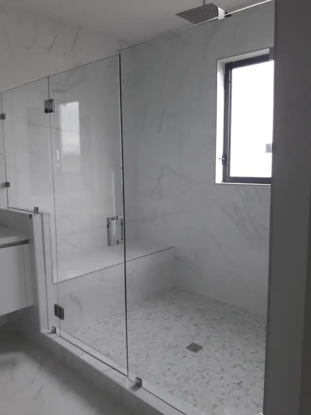 Bathroom remodel with marble glass shower