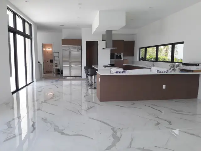 Open modern kitchen remodel with marble floor in Hollywood, FL