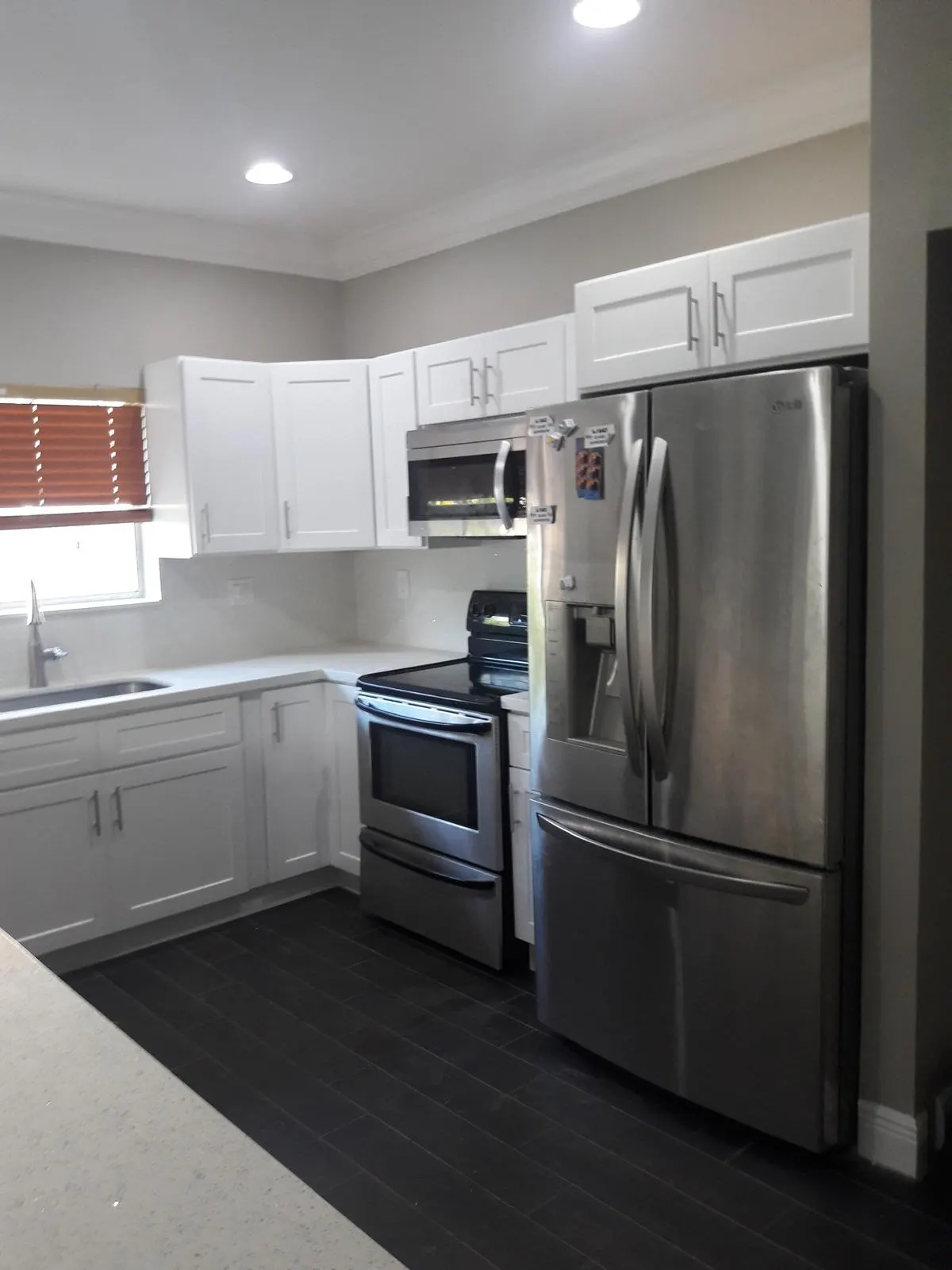 White kitchen remodel with black tile flooring in Pembroke Pines, FL